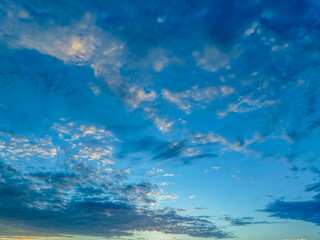 Blue sunrise sky with clouds