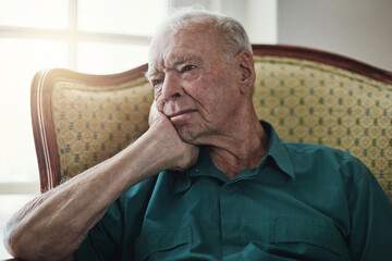Senior, man and depression with thinking of memory in retirement home with remember, lonely and...