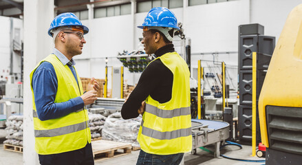 Engineers Having Discussion in Industrial Facility