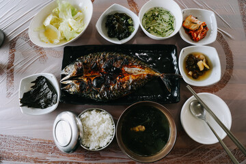 Set meal with grilled mackerel fish and side dishes. Korean food.