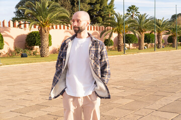 young visitor strolls around Marrakech, male tourist in Morocco in public garden, cultural...