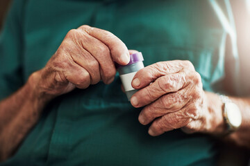Senior man, hands and medication with pills for prescription, chronic illness or sickness at old...