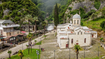 the hydroelectric dam and the church on the Psyrtskha River in New Athos.