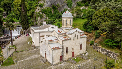 the hydroelectric dam and the church on the Psyrtskha River in New Athos.