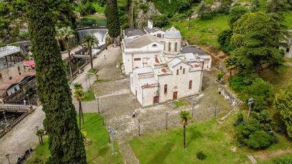 the hydroelectric dam and the church on the Psyrtskha River in New Athos.