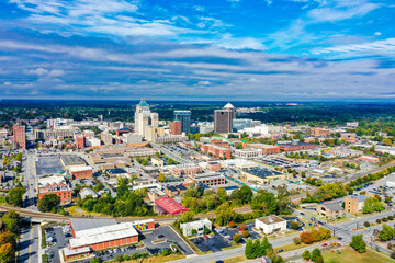 Aerial view of the city of Greensboro, North Carolina, showing the downtown skyline.