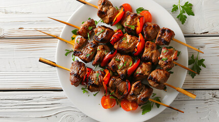 Plate with delicious shish kebab on light wooden table