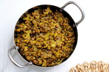 Akkha Masoor is an Indian dish cooked with whole red lentils, spices, onions, tomatoes, garlic, and...