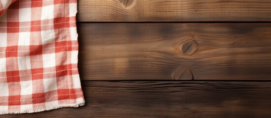 Wooden background with a kitchen cloth napkin and empty space for text. with copy space image. Place for adding text or design