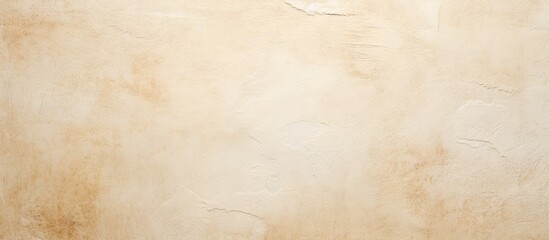 A rough textured white beige paper background with light spots offering a blank copy space image in...