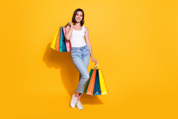 Full body photo of attractive young girl hold shopping bags wear trendy white outfit isolated on...