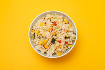 Cooked white rice mixed with colorful vegetables
