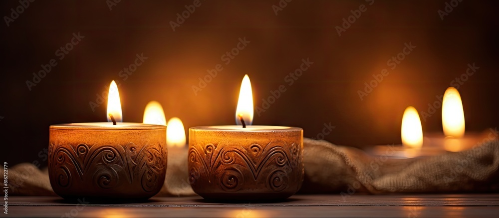 Aufkleber The soft flickering glow of candle lights creates a warm and cozy ambiance perfect for relaxation and intimacy. with copy space image. Place for adding text or design