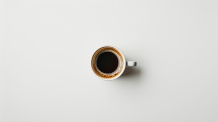 top view of a glass of coffee on white background
