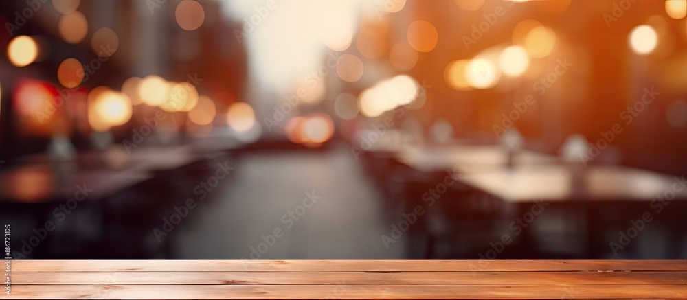 Poster There is a copy space image of a table top with a blurred restaurant in the background