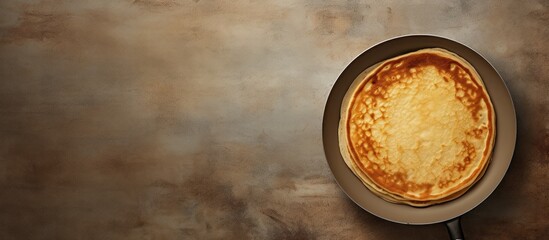 A top down view of a frying pan with a stack of pancakes leaving empty space for potential image additions. with copy space image. Place for adding text or design - Powered by Adobe