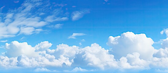 A serene blue sky adorned with fluffy white clouds providing a tranquil backdrop for any copy space image - Powered by Adobe