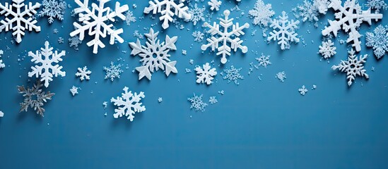 Snowy Christmas decorations on a blue background perfect for a copy space image