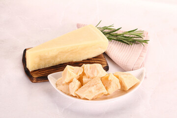 Chopped Italian hard parmesan cheese