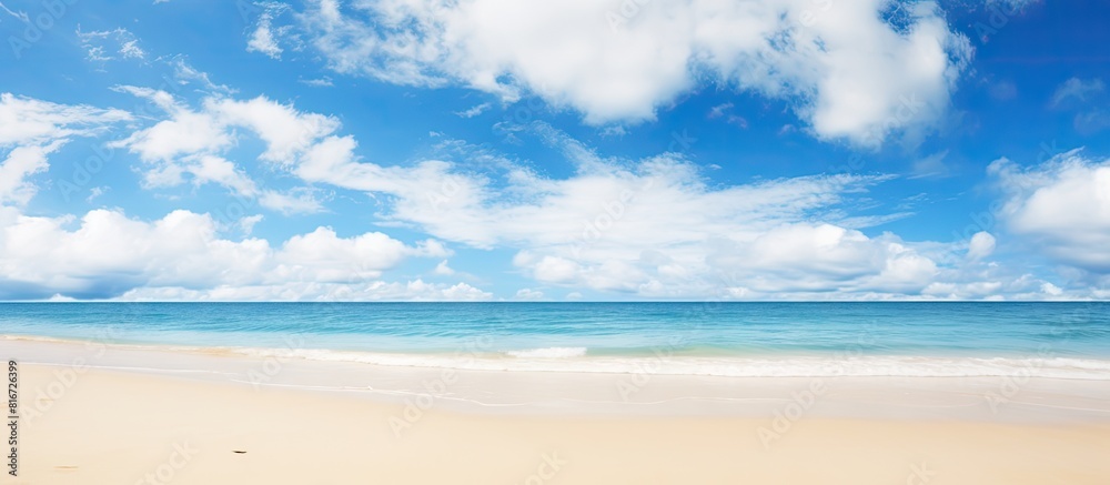Poster Tranquil serene landscape featuring a wide empty sand beach adorned by a beautiful cloudy sky offering a perfect atmosphere for relaxation Ample copy space image available for creative usage