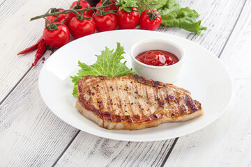 Grilled pork steak with ketchup