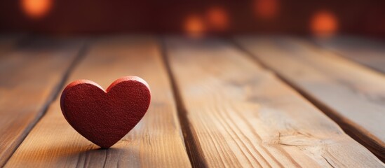 A romantic Valentine s Day vibe with a heart shaped object resting on a wooden table perfect for a copy space image