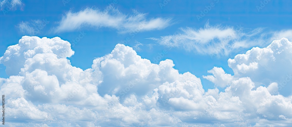 Aufkleber The image shows a clear blue sky with fluffy white clouds in the background. with copy space image. Place for adding text or design