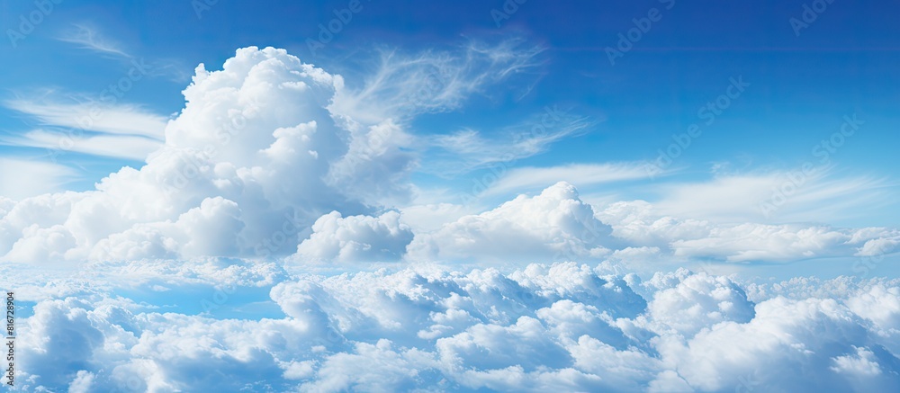 Aufkleber a serene blue sky serves as a backdrop for a panoramic view showcasing a fluffy white cloud with ple