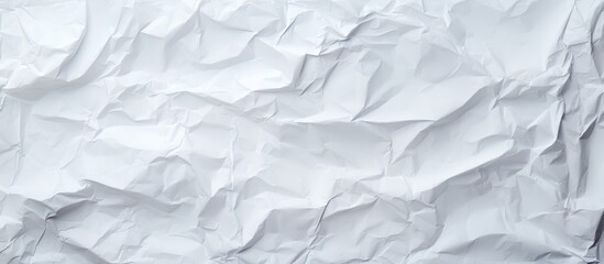 Fototapeta premium Top view of a clean white paper with a textured background resembling crumpled paper Ideal for use as a copy space image 134 characters