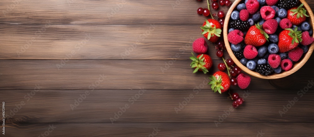 Aufkleber A top down view of a wooden table showcasing a bowl filled with raspberry smoothie and an assortment of berries leaving space to add text or images. with copy space image