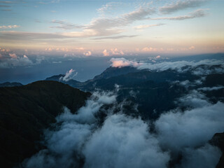 Scenic view of mountain peaks in the clouds in Pico Ruivo train in Madeira Island, Portugal