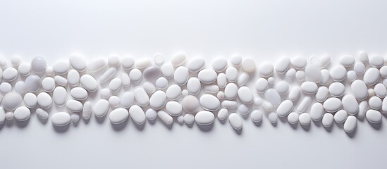 A white background showcases pills artistically arranged creating an appealing copy space image