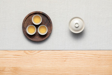 The tea banquet is placed on the table. Tea ceremony life. Some freshly brewed tea was placed on a...