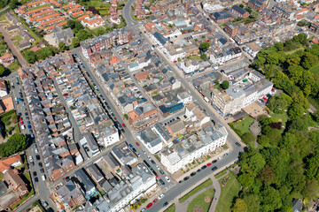 Aerial photo of the beautiful town of Filey in Yorkshire the UK, showing the sandy beach front and the residential housing estates on a sunny summers day
