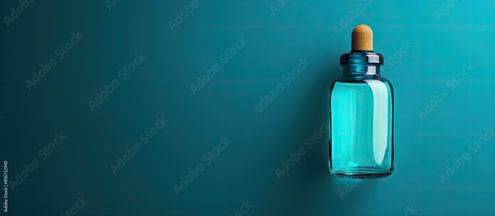Aufkleber Turquoise background showcases a bottle of medical drops creating ample copy space for text