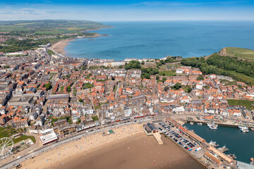 Fototapeta premium Aerial photo of the beautiful seaside town of Scarborough in the UK showing the beach front on a sunny summers day