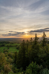 Scenic landscape of a sunset sky over the lush trees of Nolberget, Sweden
