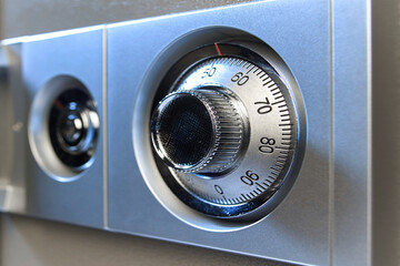 Closeup image of a mechanical safe lock.