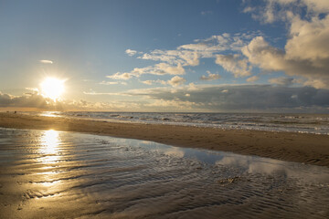 Dramatic seascape with a picturesque beach at sunset