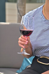 Enjoying a Glass of Red Wine in a Cozy Outdoor Setting