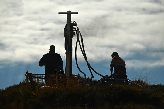 drilling a hole on the summit