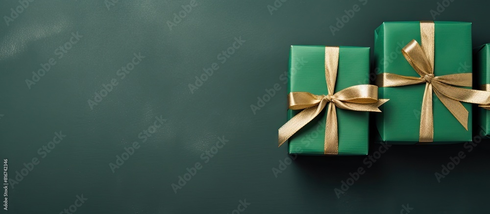 Aufkleber Top view of three handcrafted gifts arranged on a green background with copy space available for your text