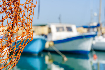 Fishing net and boats, historic port of Jaffa