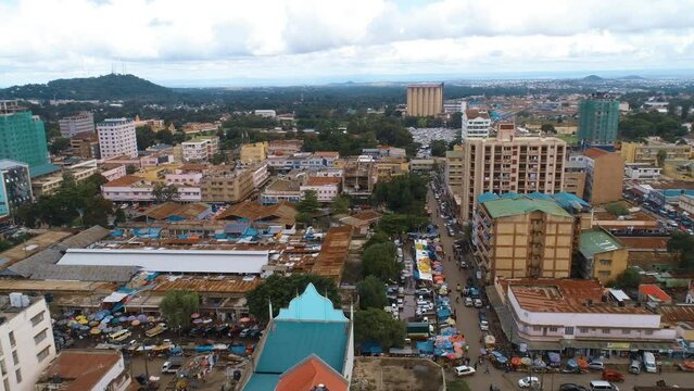 Drone footage of the cityscape of Arusha located at the base of volcanic Mt. Meru in Tanzania