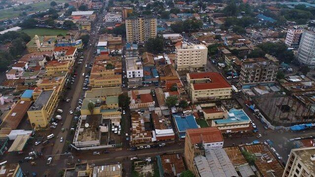 High drone footage of the downtown of Arusha city on a cloudy day in East Africa's Tanzania