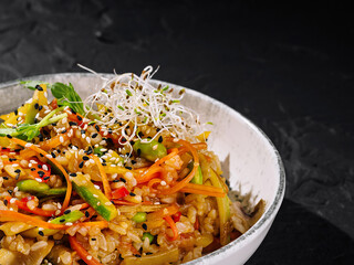 Colorful asian fusion rice bowl close up