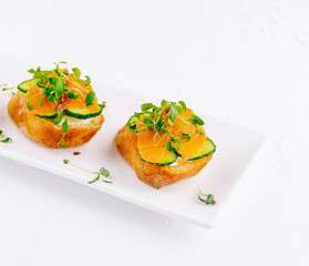 Fresh salmon canapes with microgreens