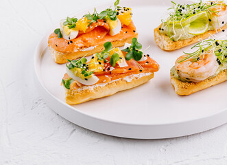 Gourmet bruschetta platter on white background