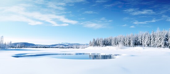 Winter scenery in Biei with a snow covered blue pond under a clear blue sky Copy space image