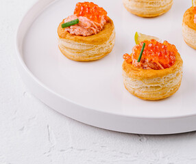 Elegant salmon tartare appetizers on white plate